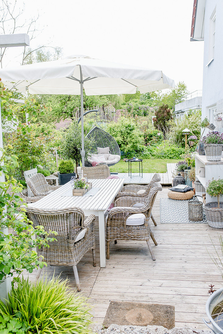 Furniture, outdoor rugs, hanging chair and ornaments on terrace