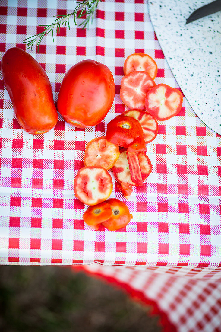 Sliced tomatoes on a camping table