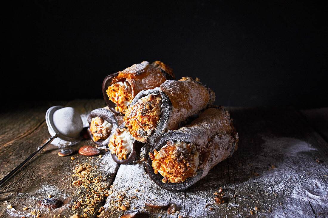 Sicilian cannoli with ricotta filling and chopped almonds (Italy)