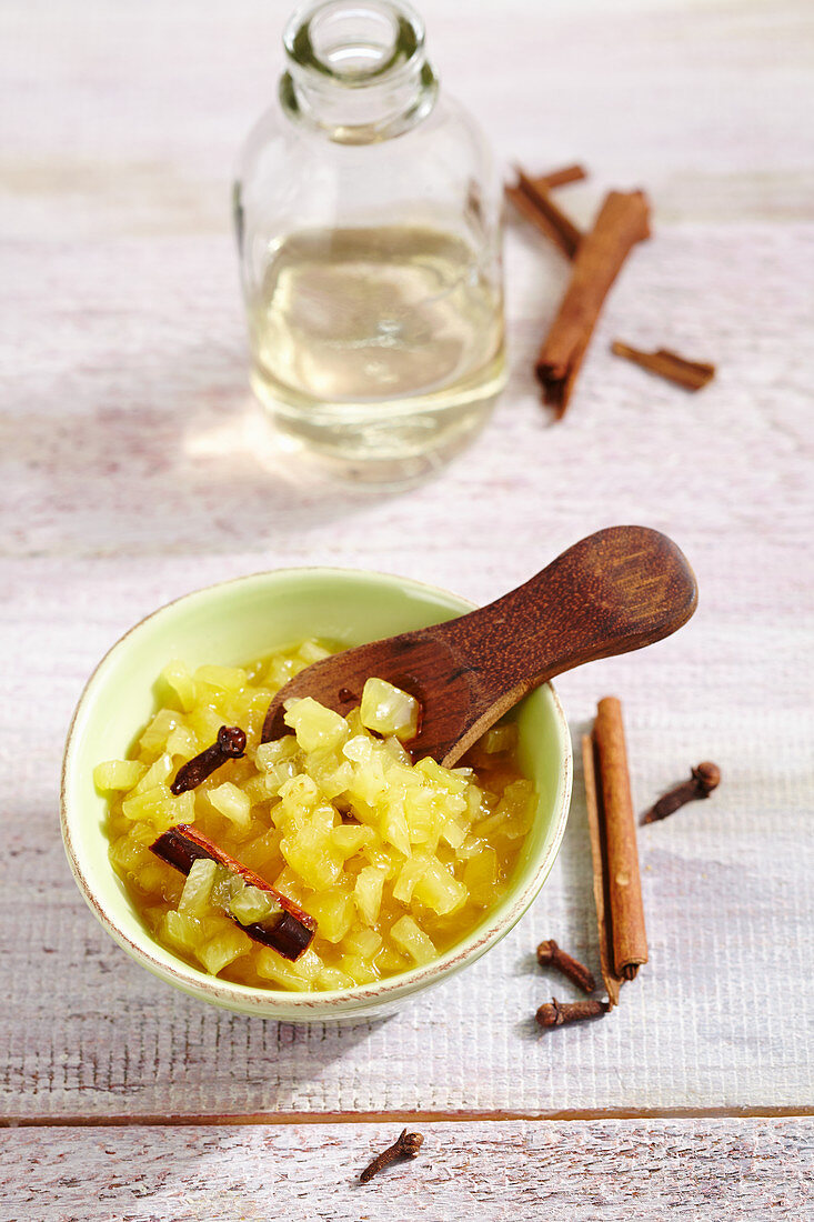 Homemade pickled pineapple with cloves and cinnamon