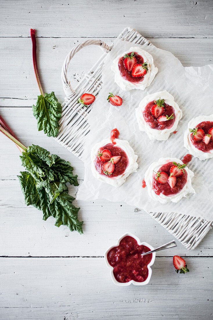 Mini pavlovas with rhubarb and strawberries