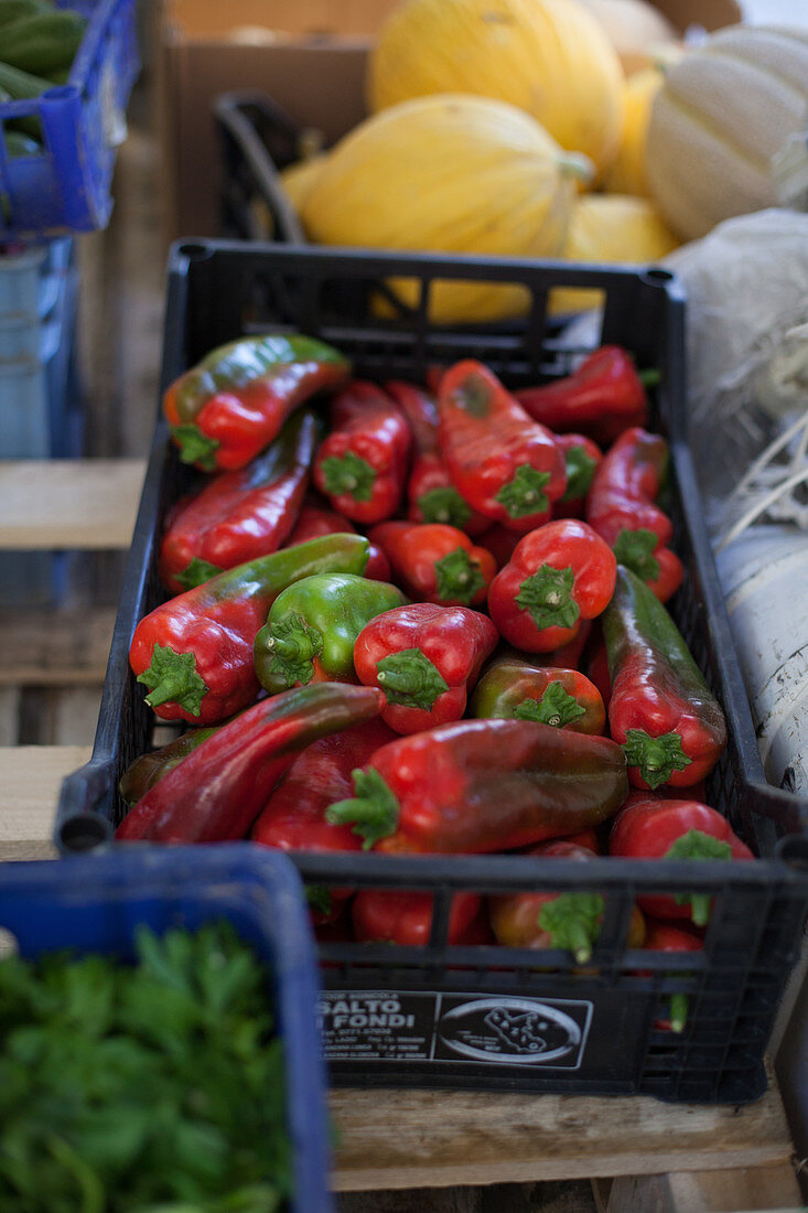 Fresh peppers in a crates at a market
