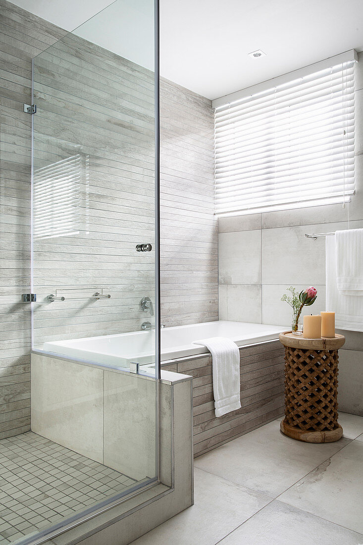 Shower and bathtub in grey, modern bathroom