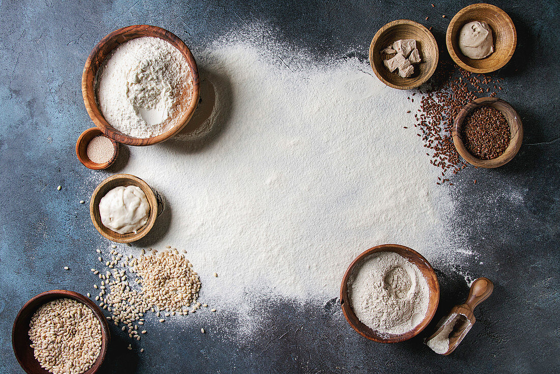 Ingredients for baking bread. Variety of wheat and rye flour, grains, yeast, sourdough and sifted flour