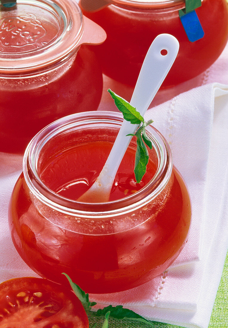 Ripe tomato and sour apple jam in jars