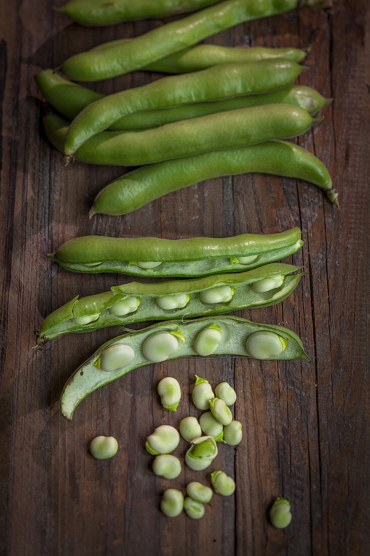 Fava beans on a wooden background
