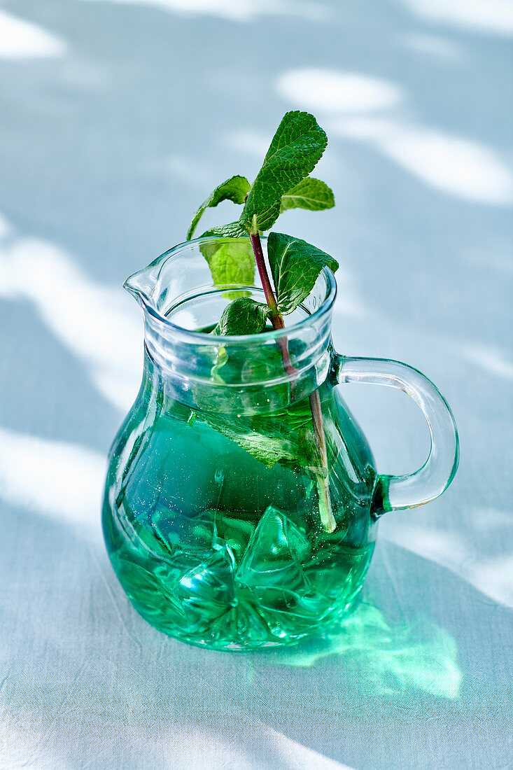 Mint water in a glass mug