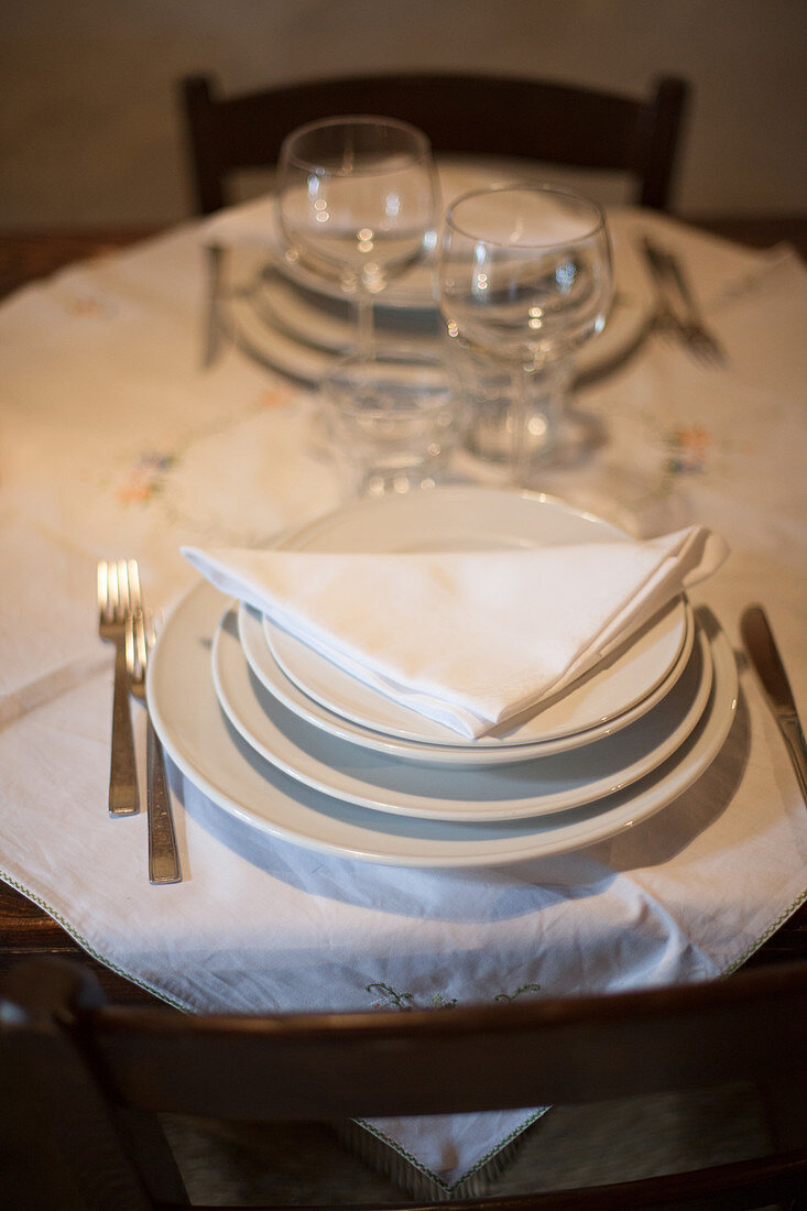Two place settings on a rustic table