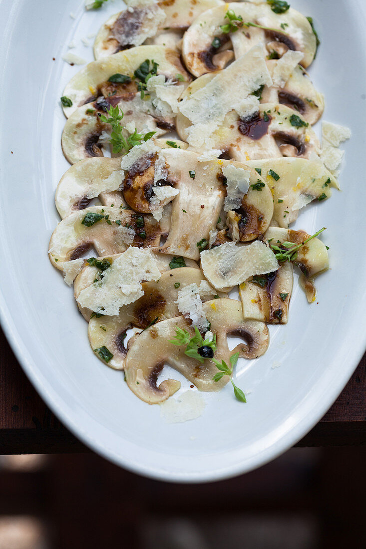 Mushroom carpaccio with herbs and parmesan