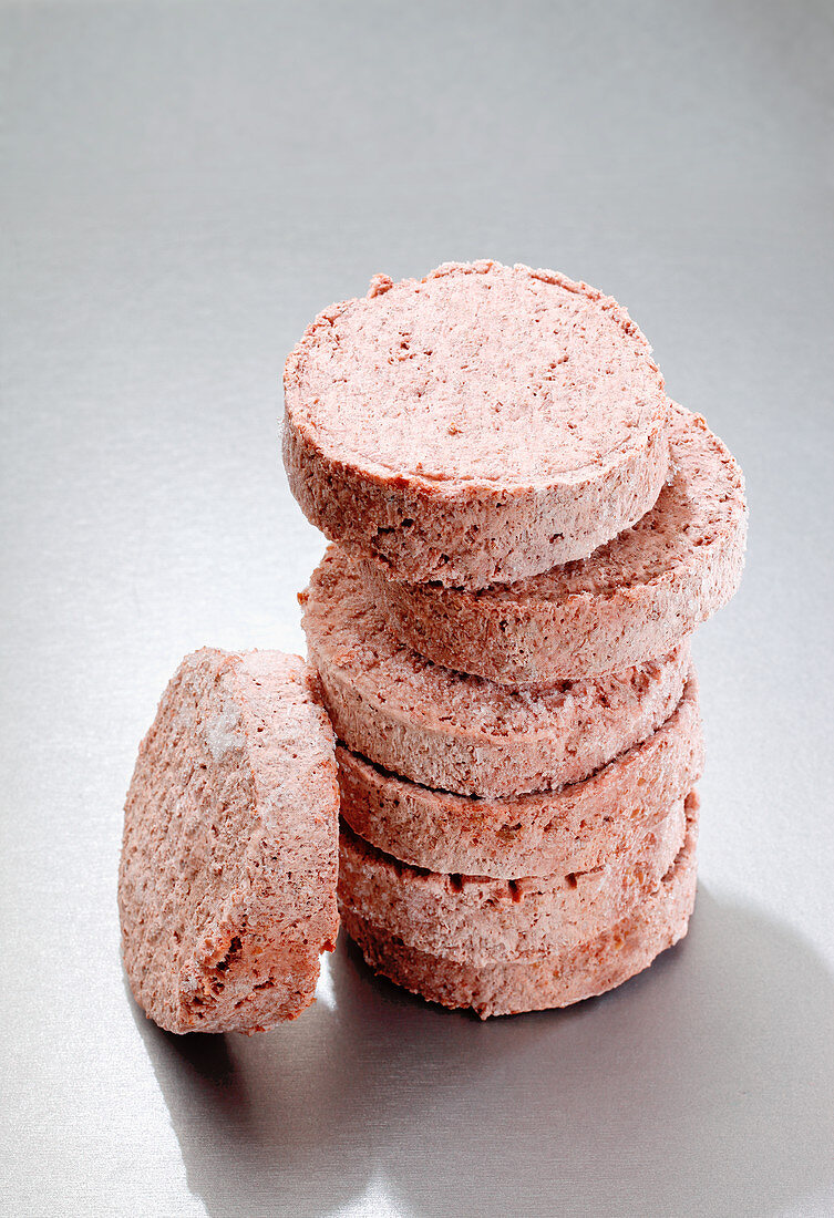 Stacked frozen hamburger patties