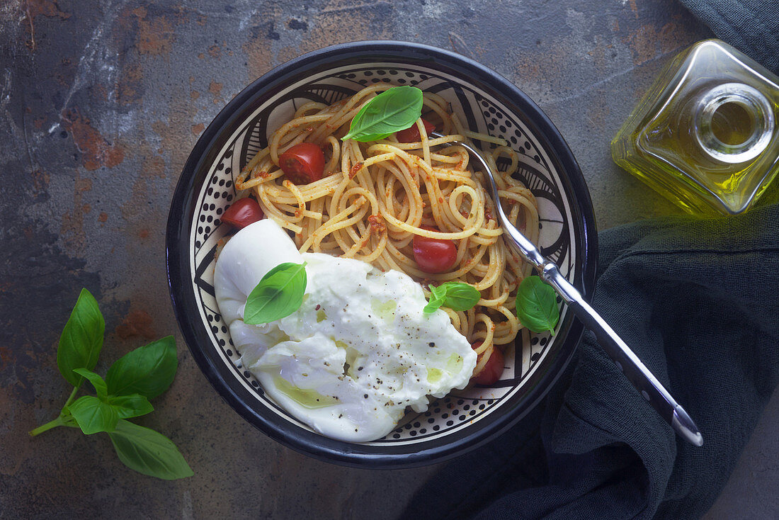 Spaghetti with pesto rosso and burrata