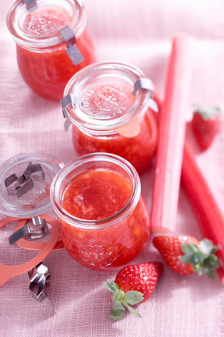 Rhubarb and strawberry jam in glass jars