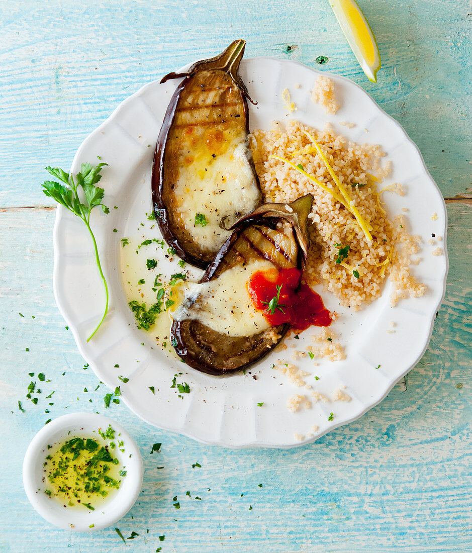Grilled aubergines with mozzarella, tomato sauce and couscous