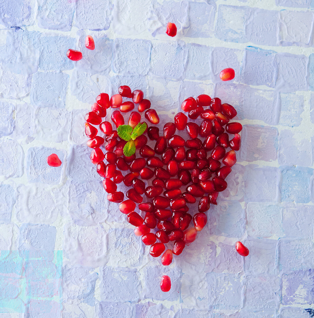 Pomegranate Heart on White Background 