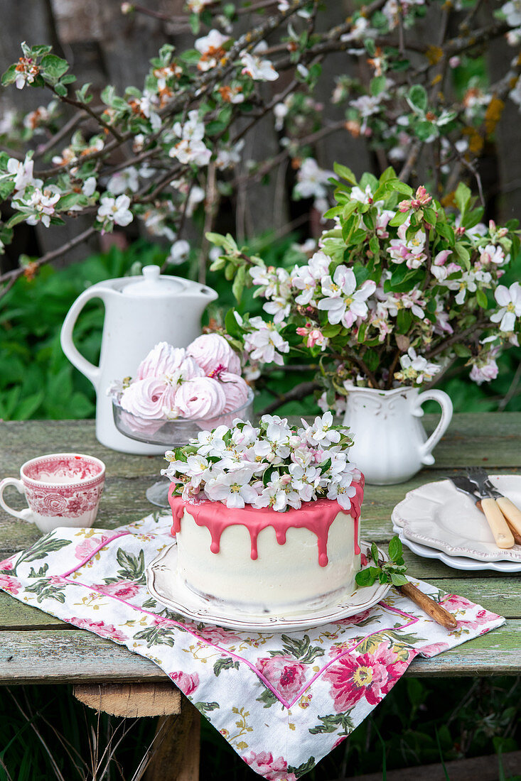 Blossom cake with strawberry white chocolate in a garden
