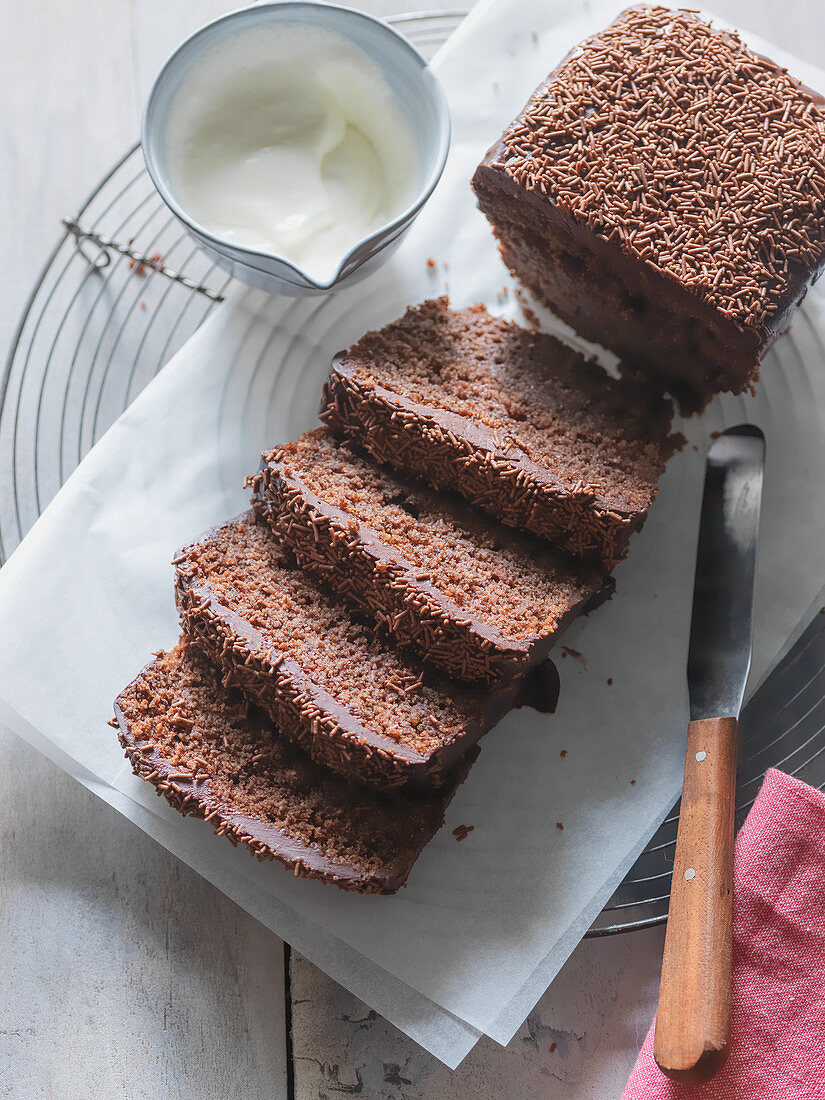 Chocolate cake, sliced, with cream