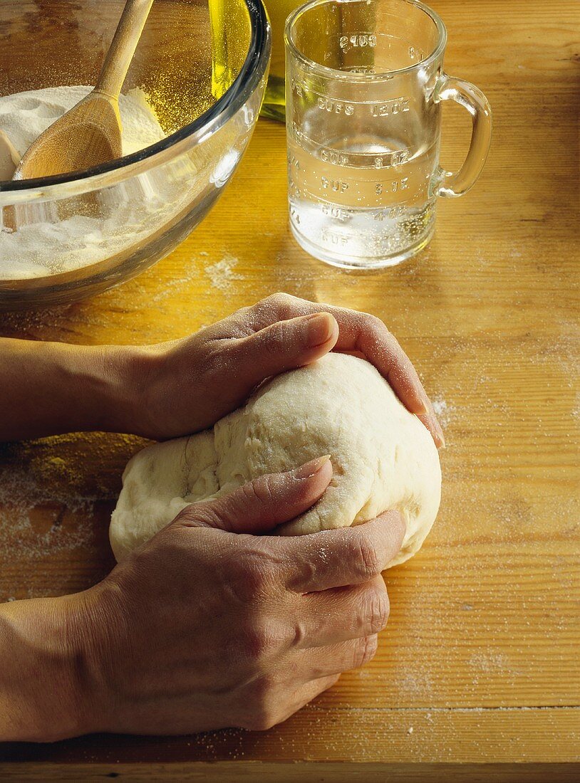 Making pizza dough (kneading the dough)