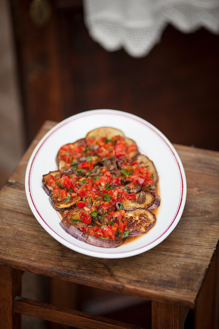 Aubergines with tomatoes and oranges