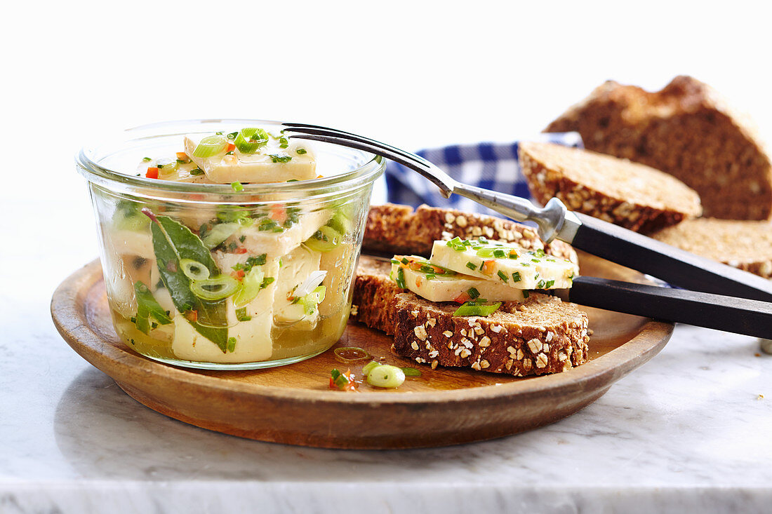 Pickled marinated creamy Romadur with fresh herbs and wholemeal bread