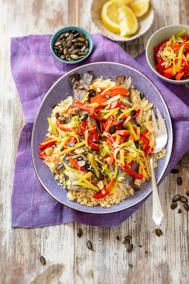 Trout with couscous, pepper and leek