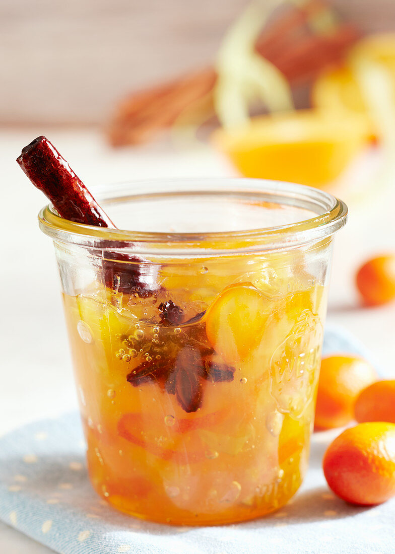 A jar of exotic spiced jam with kumquats, star fruit, star anise and cinnamon