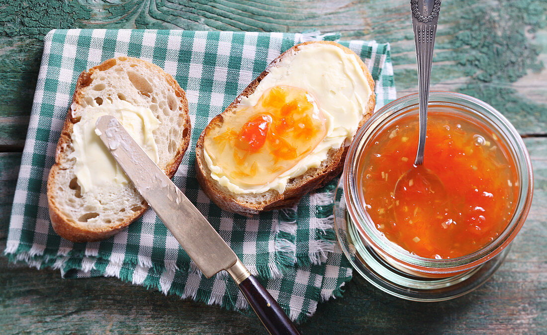 Grapefruit jam with ginger on buttered bread