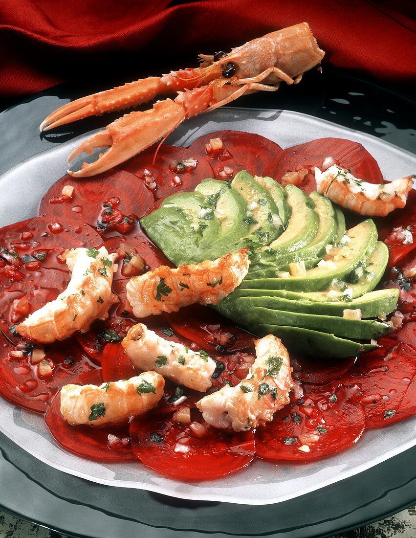 Beetroot carpaccio with avocado fans and shrimp tails