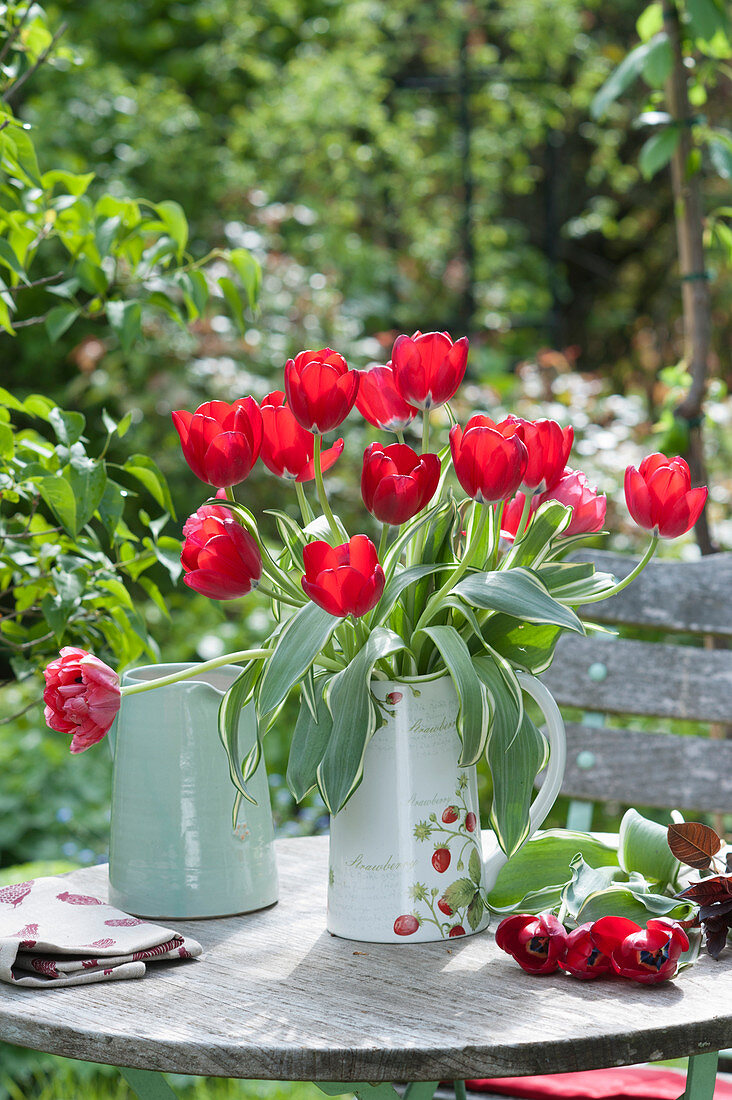 Bouquet of red tulips in a jug