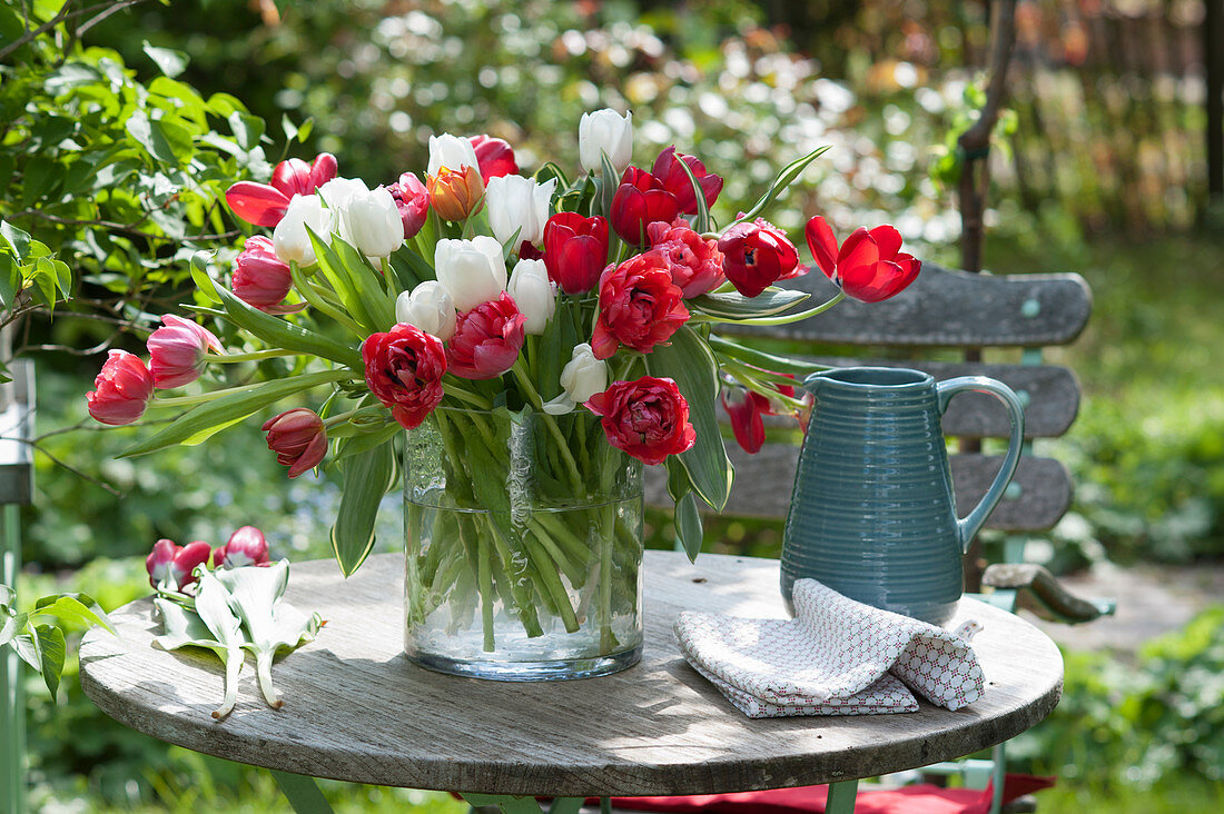 Vase of tulips on terrace table