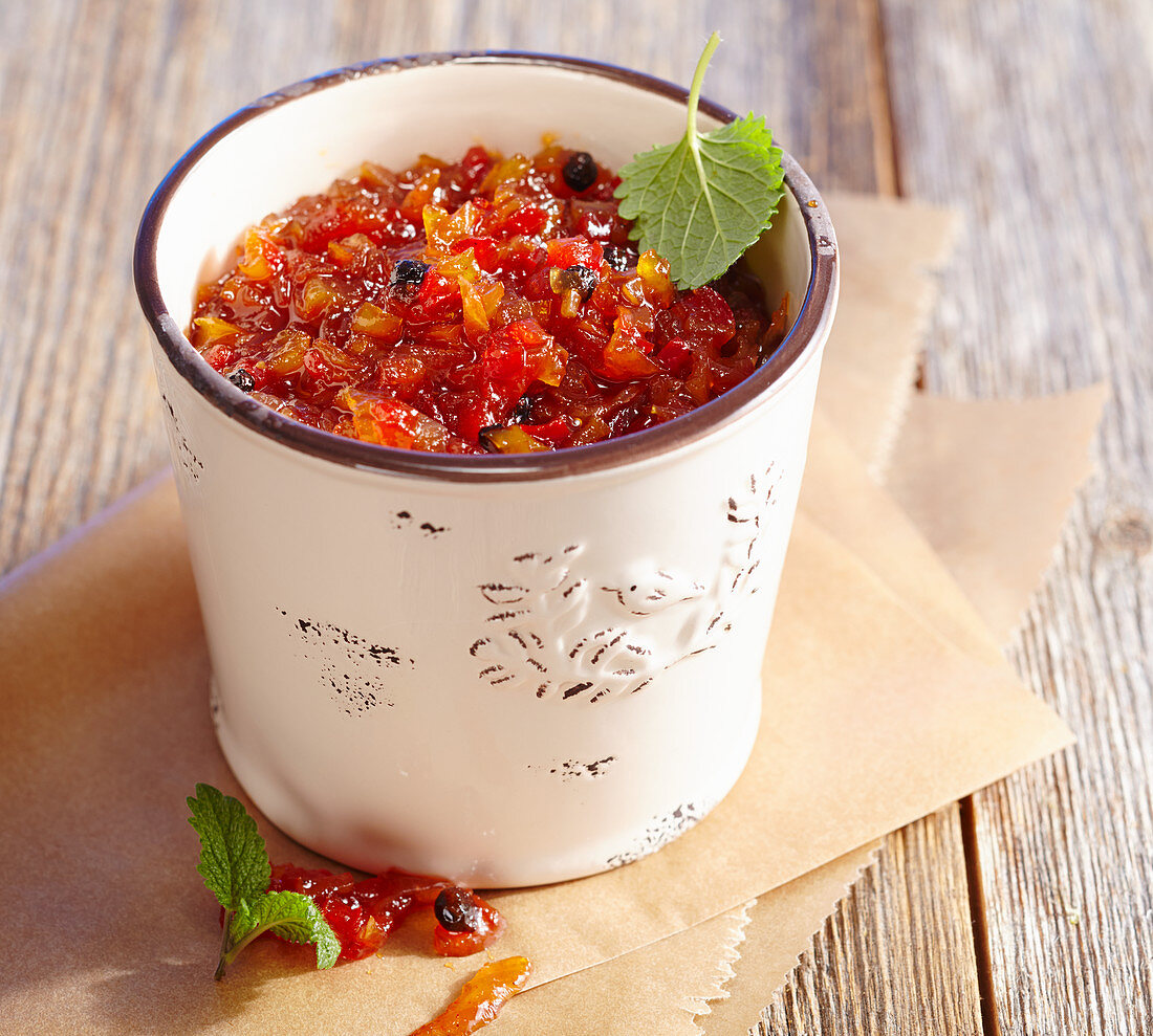 Spicy pepper relish in a ceramic pot