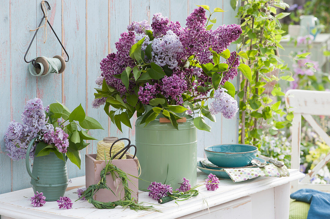 Bouquets of lilac branches, a grass heart as decoration