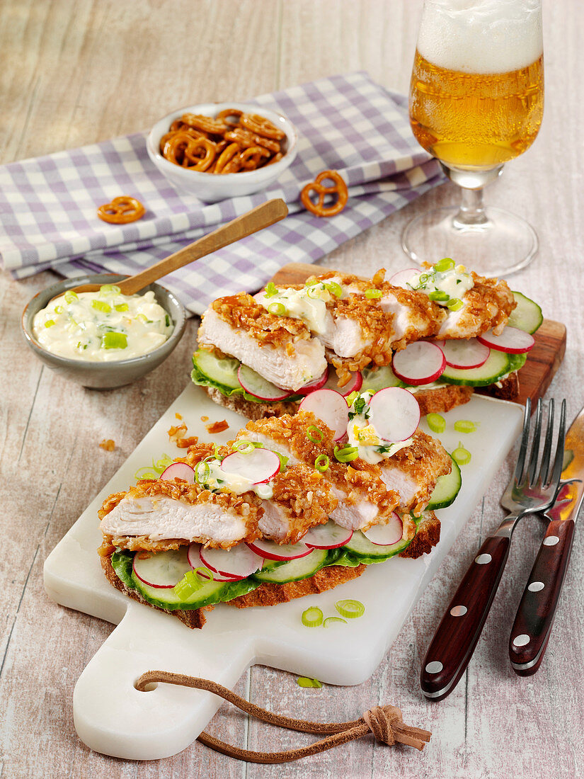 Sandwiches with chicken schnitzel and radishes