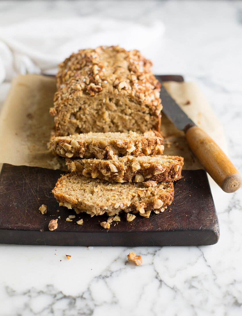 Banana bread, sliced on a wooden board