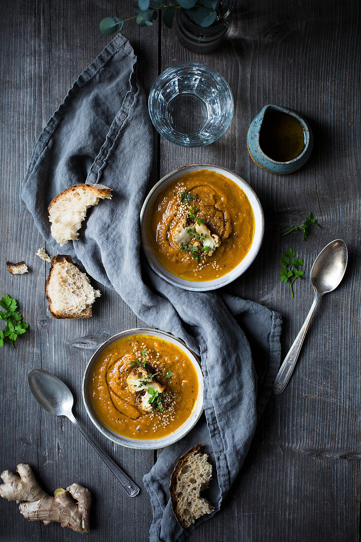 Carrot soup with roasted cauliflower served with bread