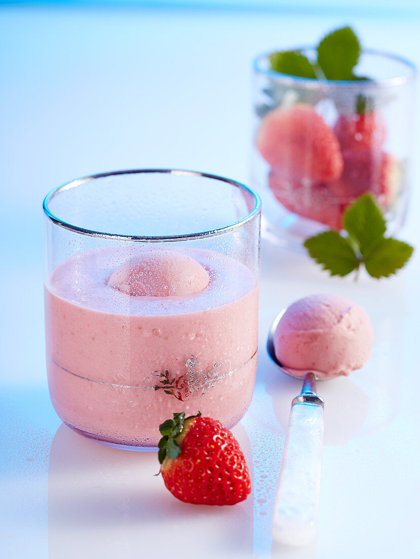 Strawberry and coconut smoothie shake with a scoop of strawberry yoghurt ice cream