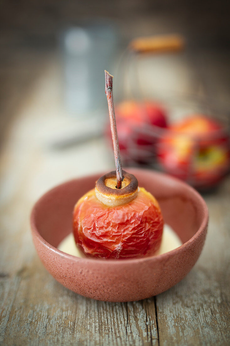 A baked apple filled with marzipan and raisins