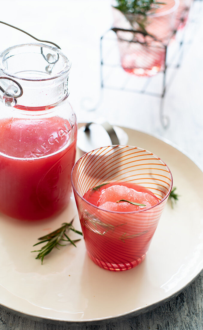 Homemade blood orangeade with rosemary