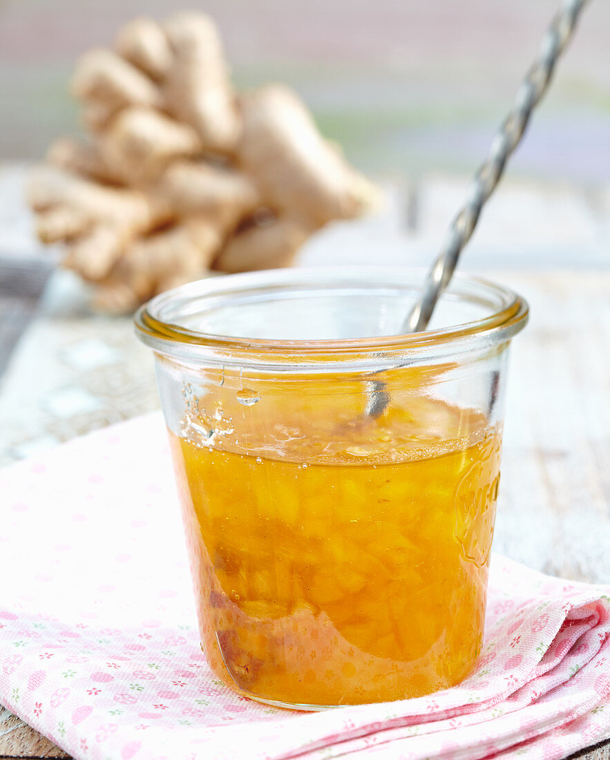 A jar of pineapple and mango jam with ginger