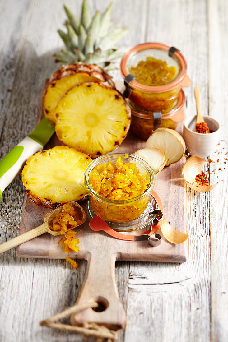 Pineapple chutney with curry in glass jars
