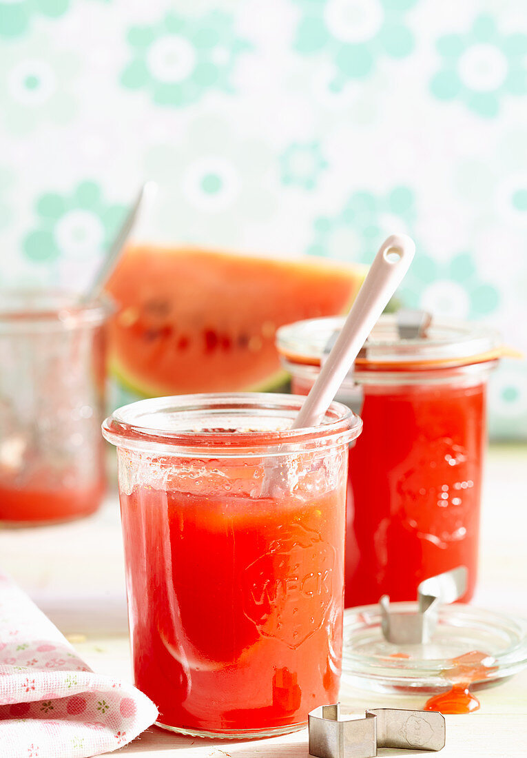 Jars of watermelon jelly with raspberries