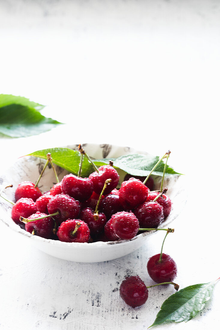 Cherries in a white bowl