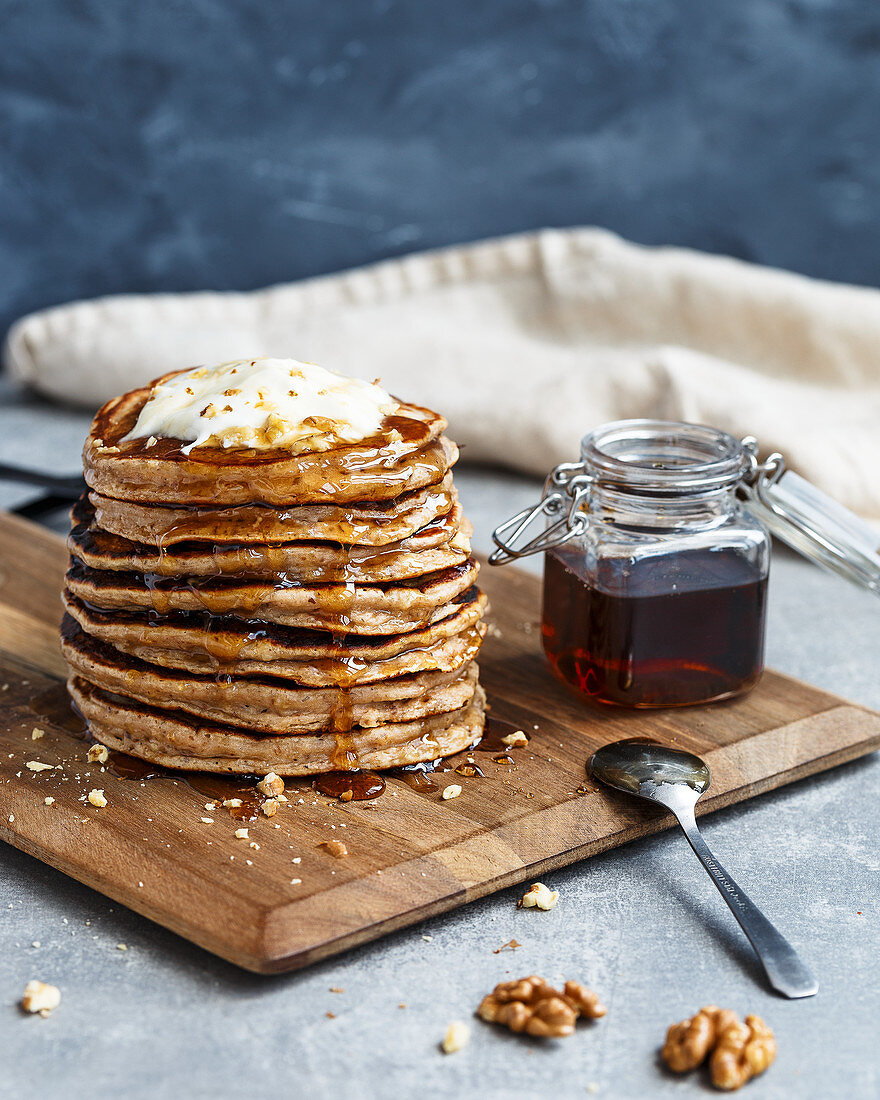 Banana walnuts pancakes with syrup