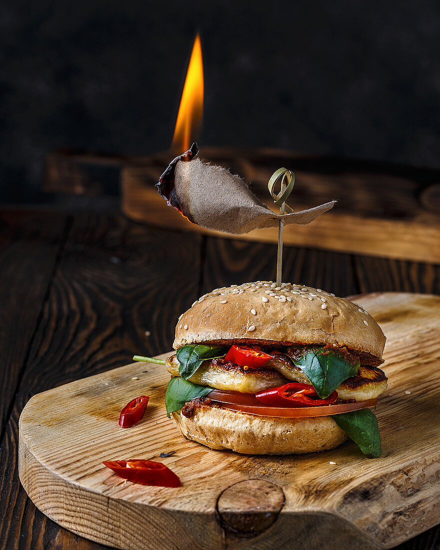 Burger with grilled halumi, tomatoes, chilli and basil