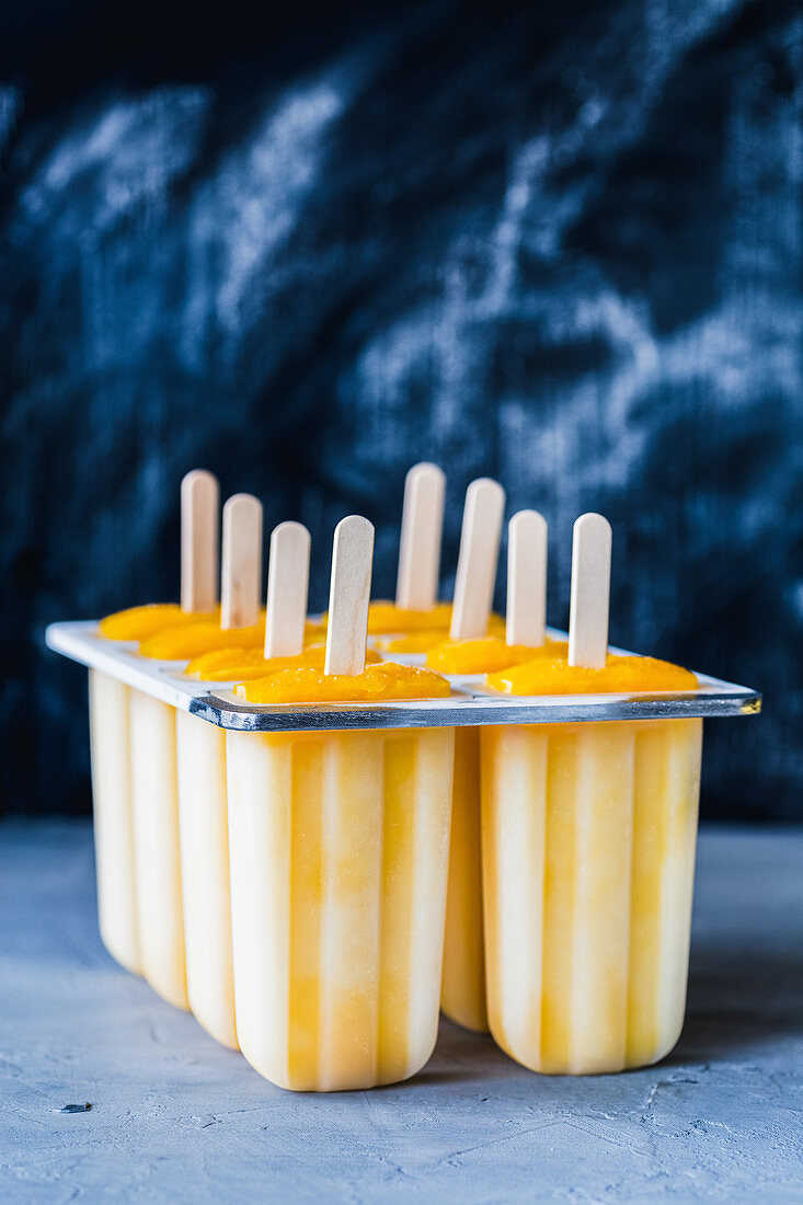 Homemade mango ice cream in plastic cups