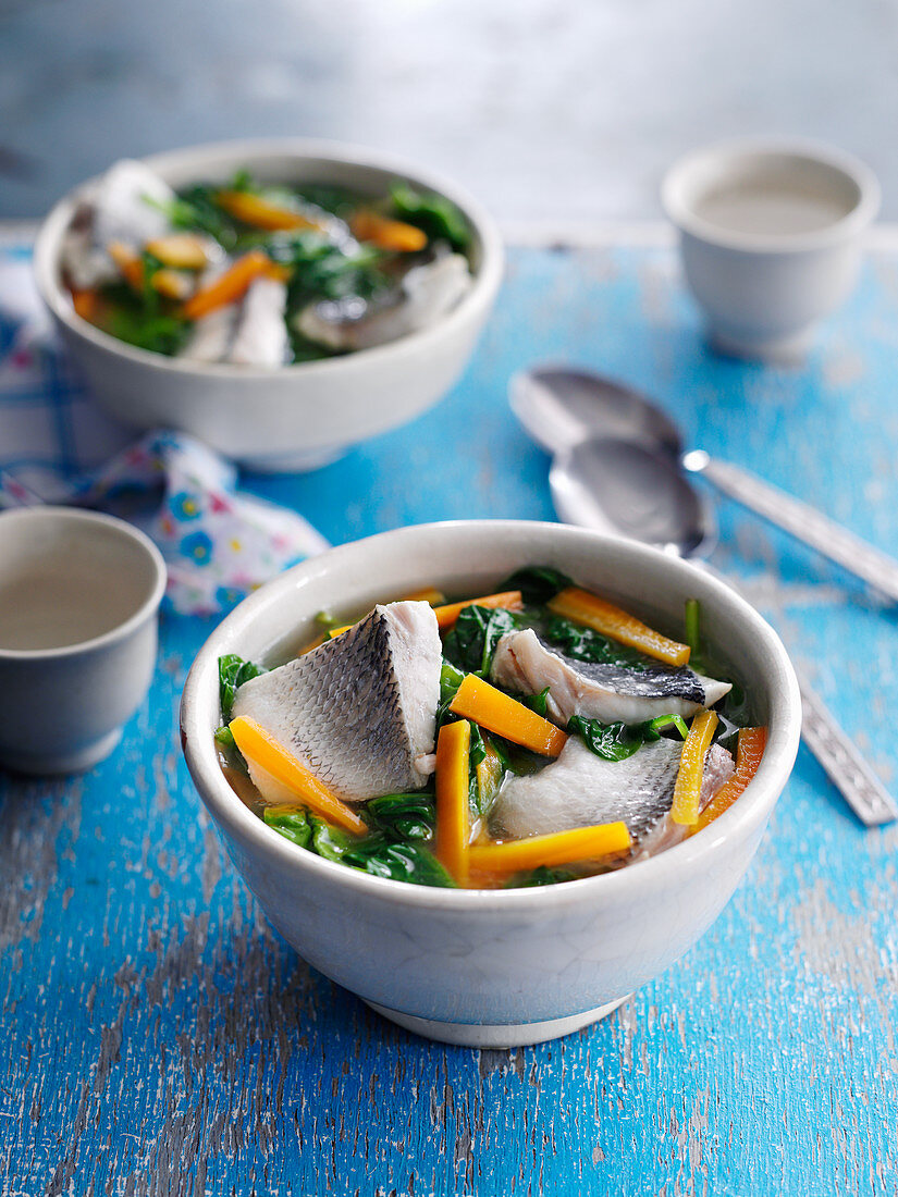 Healthy fish soup with carrots and pak choi (China)