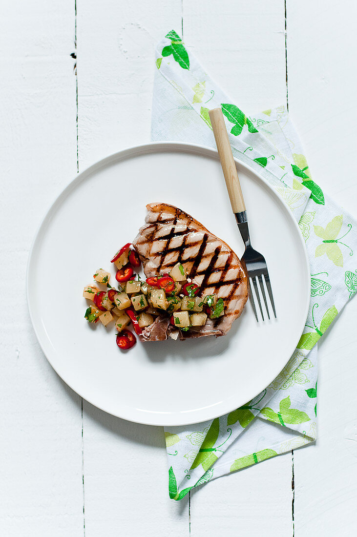 Grilled pork chop with coriander and chili vegetables