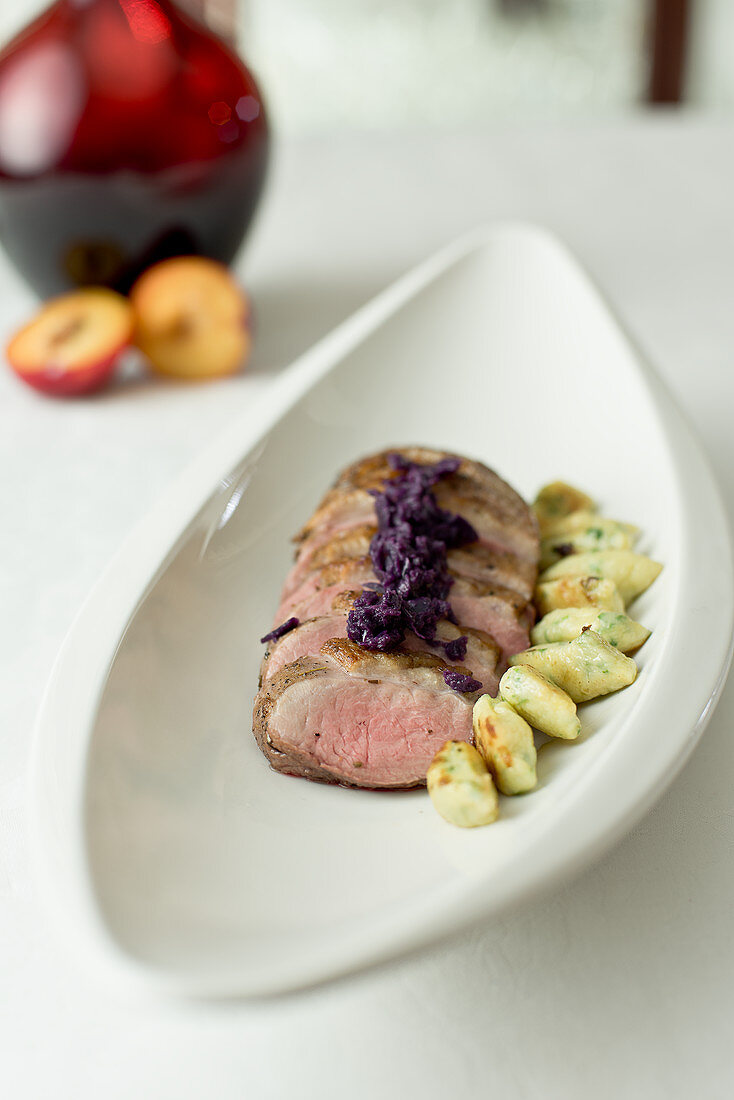 Pork fillet in nutmeg with red cabbage and potato parsley biscuits