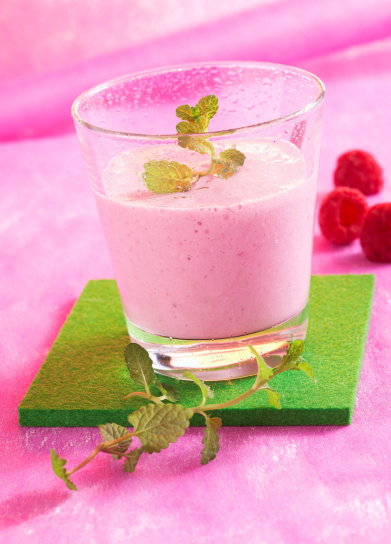 Milkshake with raspberries, lime, milk and mint