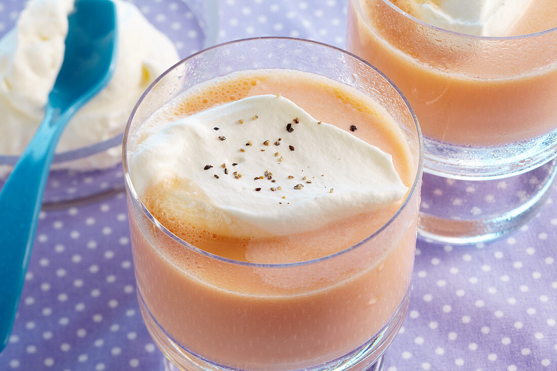 Savory carrot milk with orange and whipped cream