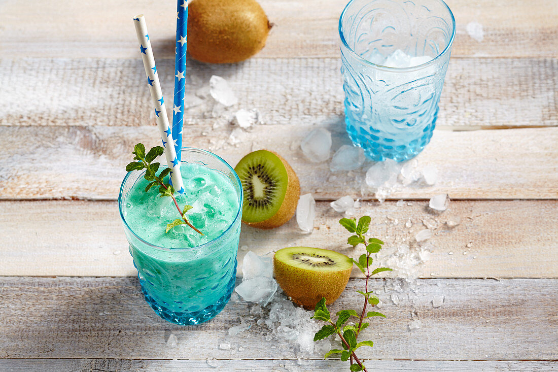 New Zealand mocktail with kiwi, coconut syrup, pineapple and lemon juice and blue curacao syrup